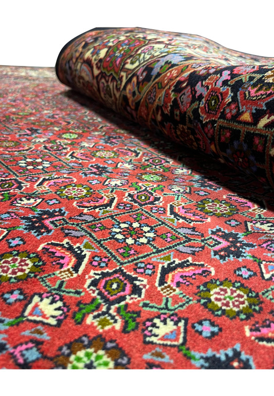 Rolled view of rare size Persian Bijar iron rug showing heavy wool density and tightly packed knot structure