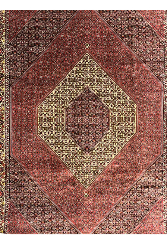 Midfield detail of brick red Persian Bijar rug with dense floral lattice