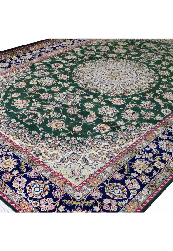 Angled view of 7x10 deep green Persian Nain 9LA rug showing navy border, ivory corner spandrels, and detailed floral vine pattern