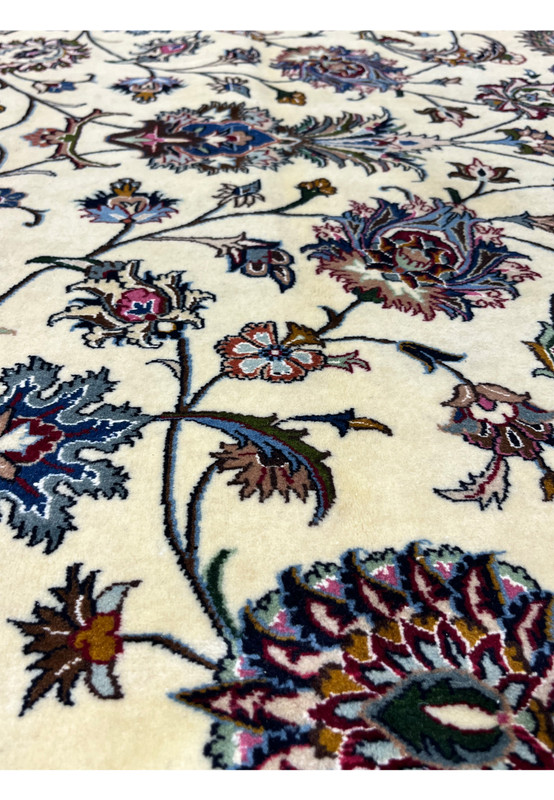 Detailed floral vine and palmette pattern on signed Persian Mashad Saber rug