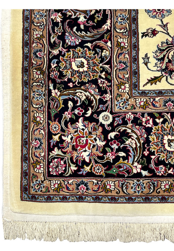 Dark navy floral border detail of signed Persian Mashad Saber Persian rug