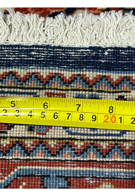 Zoomed view of rug backside showing tight knot structure and high-quality Persian Sarough weaving