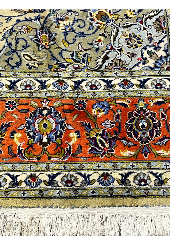 Border close-up showing layered guard borders and traditional Kashan floral design