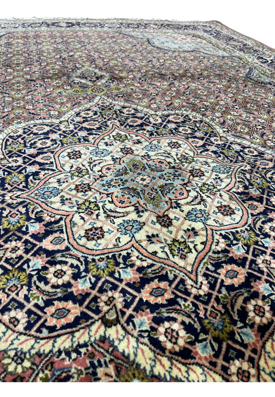 Zoomed medallion detail of Persian Bijar rug showing layered geometry and fine wool definition.