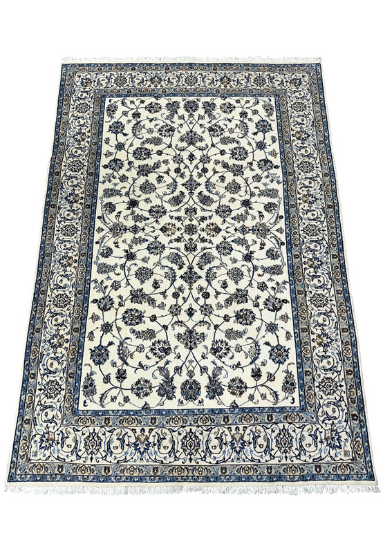 Top view of Persian Nain 9 LA rug showing balanced allover floral pattern on ivory background