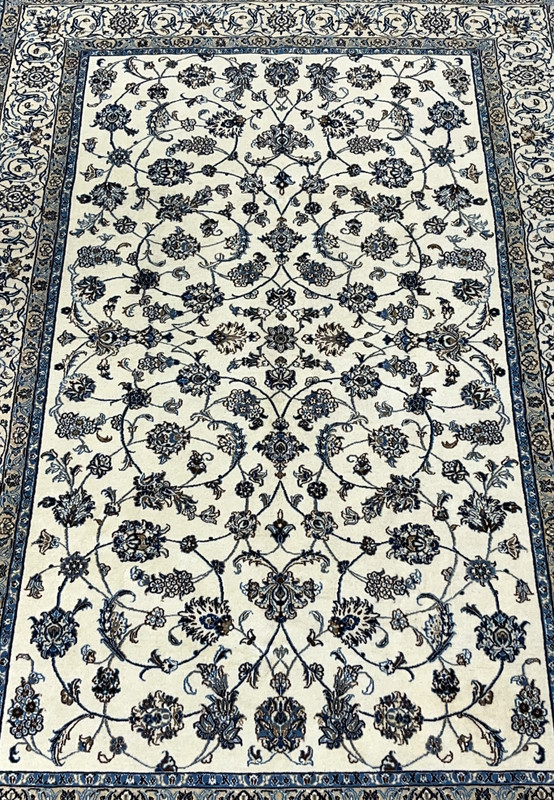 Close view of allover floral field on Persian Nain wool and silk rug