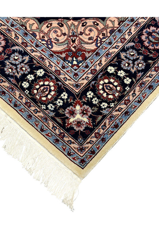 Side edge of Persian Tabriz rug showing clean binding and precise hand-knotted finish