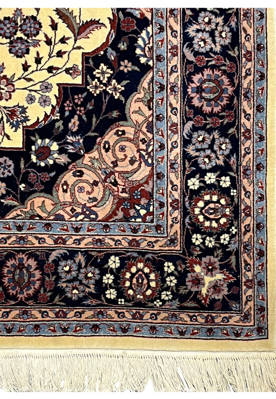Main border of Persian Tabriz rug featuring layered floral motifs and fine knot definition