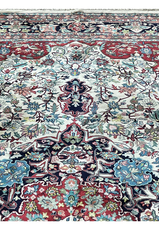 Close-up of floral vines and silk pile texture in ivory field