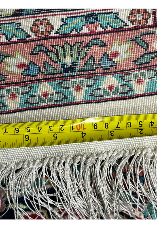 Backside view with ruler showing precise scale and fine knotting of 6x9 handwoven oriental silk rug