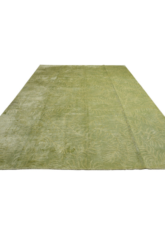 Laid-down view illustrating the full scale, soft color variation, and organic movement of this olive sage green area rug.