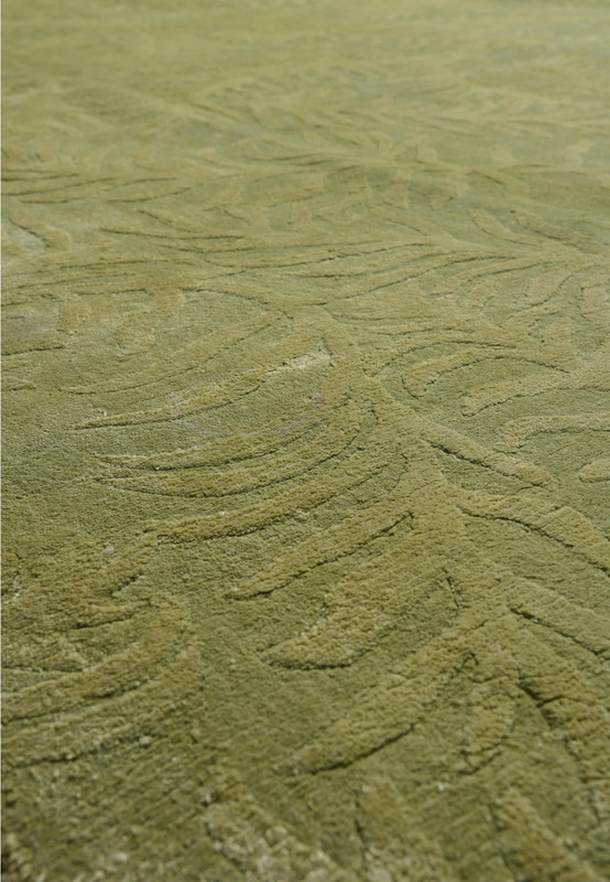 Close-up of the cotton foundation backing that supports the durable handmade construction of this modern rug.