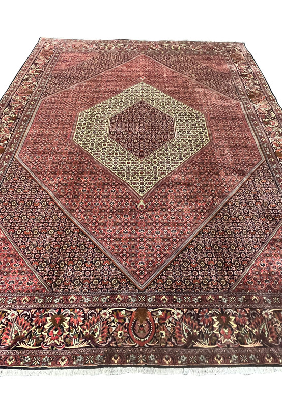 Top angle view highlighting the structure and symmetry of a large Persian Bijar iron rug