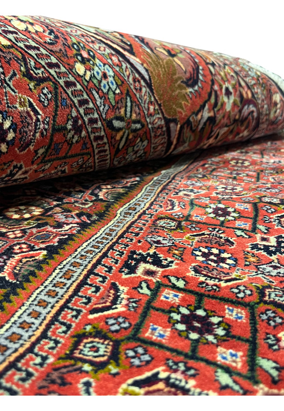Close-up texture view showing the dense wool pile and firm weave of a Persian Bijar iron rug
