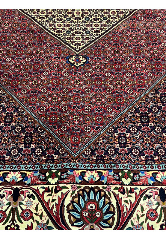 Overall pattern detail highlighting symmetrical geometric layouts across the red field of a Persian Bijar rug