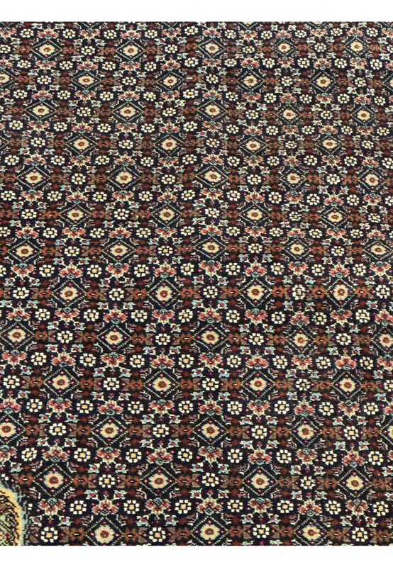 Detailed view of the classic mahi fish pattern on an 11.5 x 16.5 Persian Tabriz 50 Raj rug, highlighting precision weaving, symmetrical geometry, and rich jewel toned accents