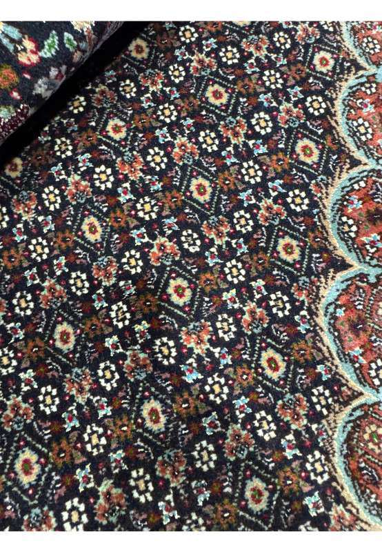 Foundation close up of an 11.5 x 16.5 Persian Tabriz Mahi 50 Raj rug showing tight knotting, fine cotton base, clean weave alignment, and exceptional structural precision