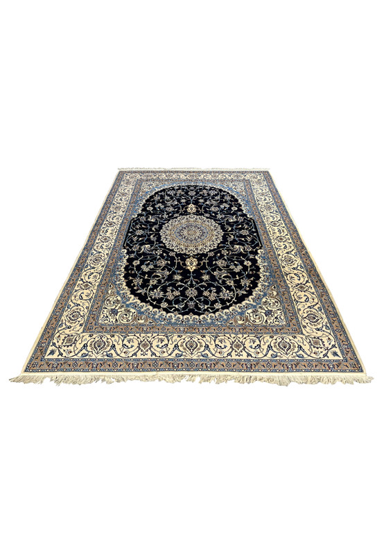 Large Persian Nain 6 LA silk rug laid flat showing navy field, ivory medallion, floral arabesques, balanced proportions, and precise Persian weaving detail