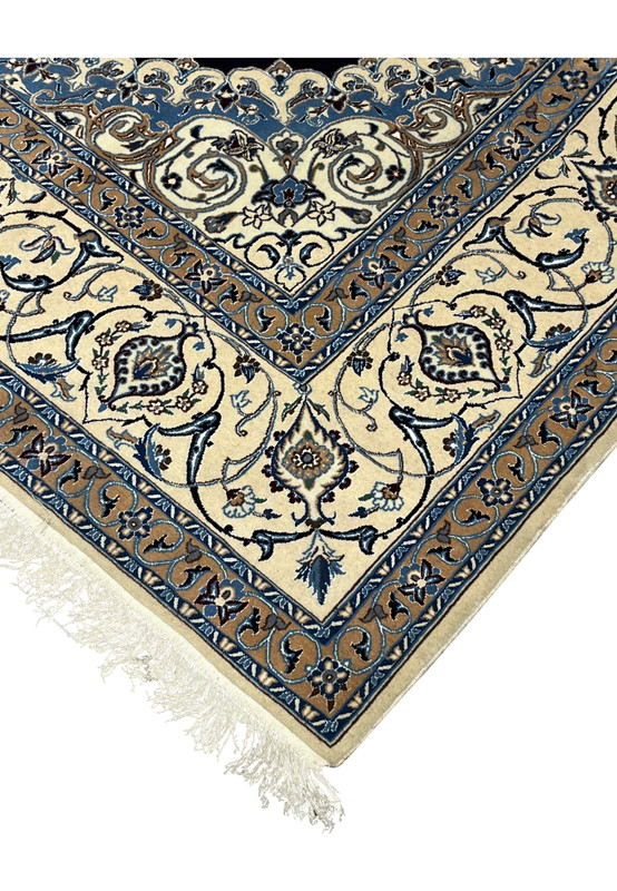 Edge view of Persian Nain silk rug showing clean finishing, even pile height, ivory tones, and tightly secured hand knotted edges