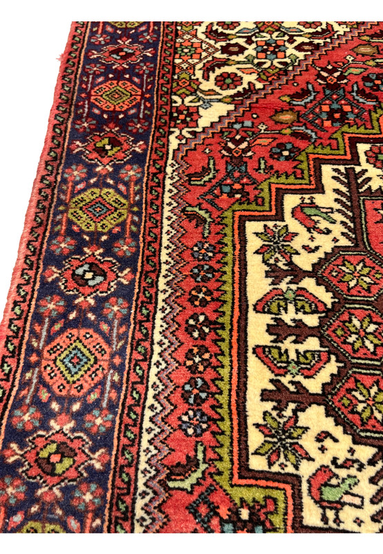 Side angle of Persian Gholtogh rug highlighting wool pile texture, geometric patterns, and traditional tribal construction