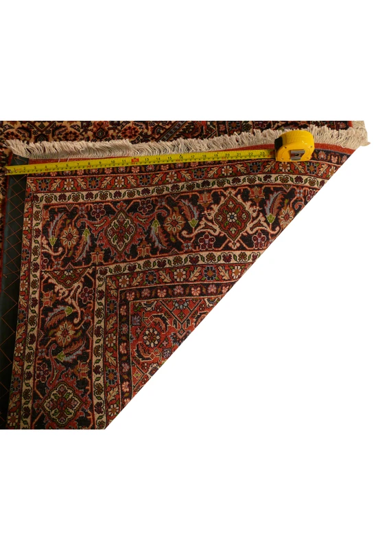 Backside measurement detail of a Persian Bijar iron rug showing dense knot structure, compressed wool weaving, strong foundation, and exceptional craftsmanship