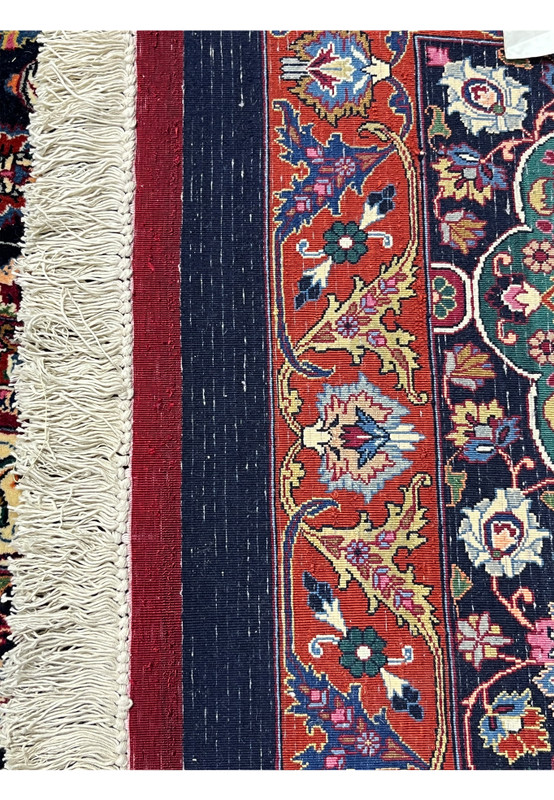 Backside view of a hand-knotted Persian Mashad rug revealing dense knot structure, precise craftsmanship, and the high-quality kork wool foundation.