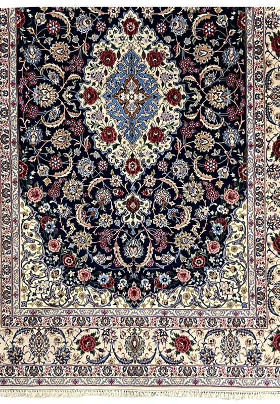 Lower section of Persian Isfahan wool and silk rug showing border clarity, floral repeats, and consistent fine knot weaving