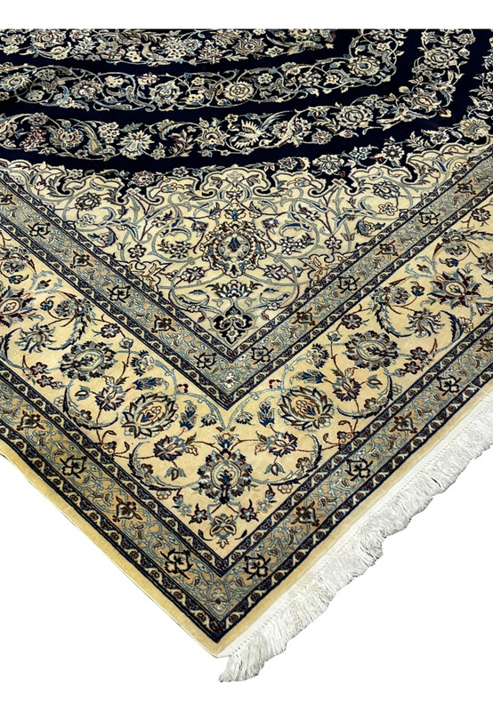 Edge detail of Persian Nain 6 La rug showing clean binding, fine knotting, and smooth silk foundation structure