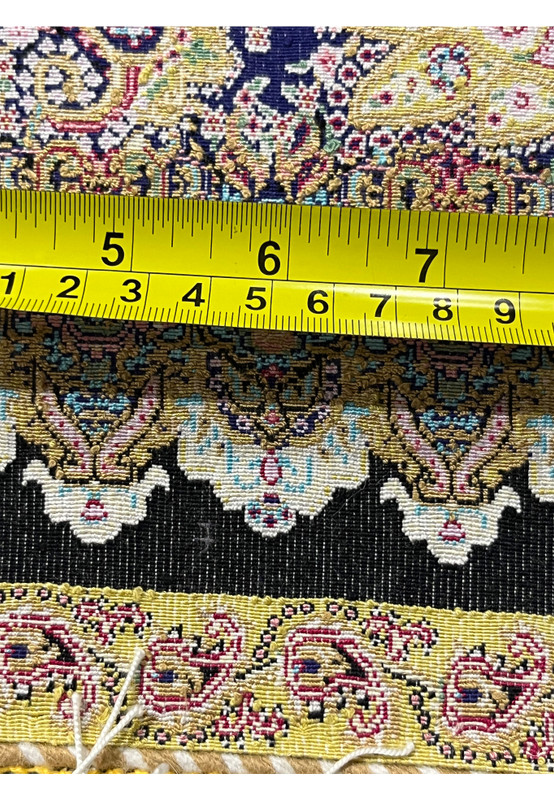 Measured backside view of a signed Persian Qum pure silk rug showing fine weave density and knot precision