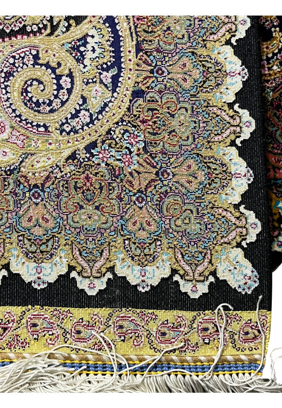 Backside of a signed Persian Qum silk rug revealing tight knot density and precise hand-knotting