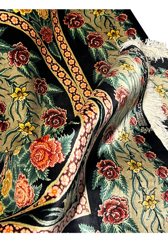 Detailed silk surface view of a Persian Qum 100 percent silk rug showing natural sheen, dense weaving, and refined floral pattern clarity