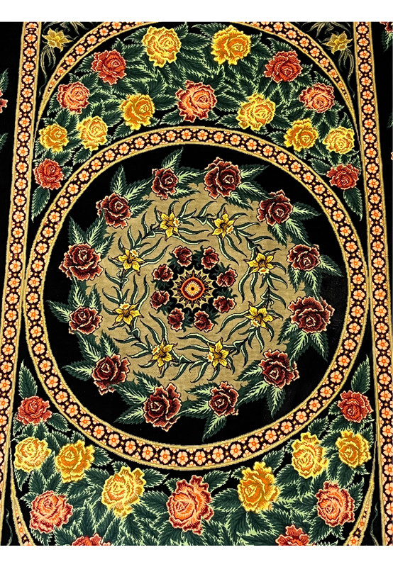 Central medallion detail of a 3'5 x 5'2 Persian Qum 100 percent silk rug featuring circular floral symmetry, fine knot density, and rich color contrast