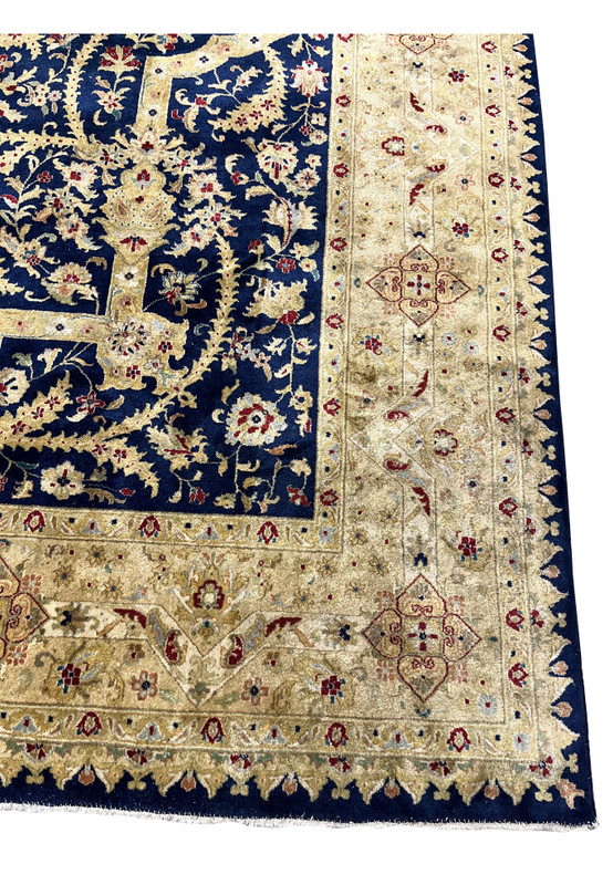 Detailed border view of an Oriental Agra rug with repeating floral patterns, aged gold palette, subtle repairs, and consistent distress along the edges