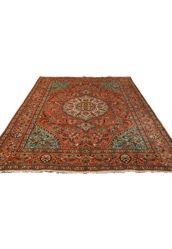 Top view of an 8'2 x 11'2 Paradies Persian Tabriz rug showing symmetrical garden design, ivory medallion, and surrounding bird motifs