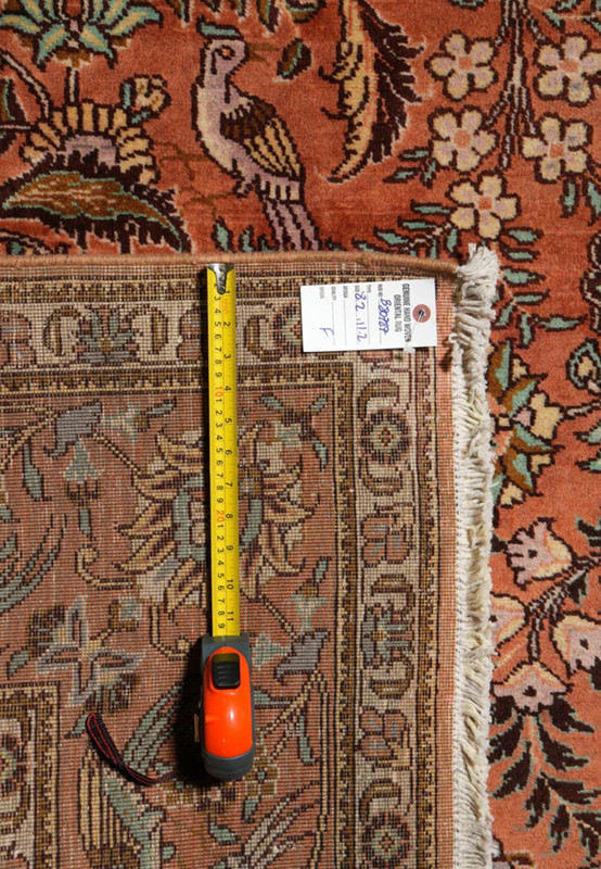 Backside view of an 8'2 x 11'2 signed Paradies Persian Tabriz rug revealing tight hand-knotting, cotton foundation, detailed pattern clarity, and craftsmanship
