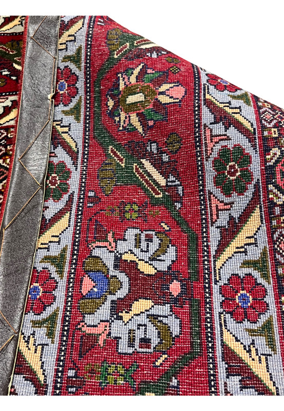 Full backside view of Persian Senneh rug revealing consistent knotting, clean structure, and well-preserved traditional handwoven construction