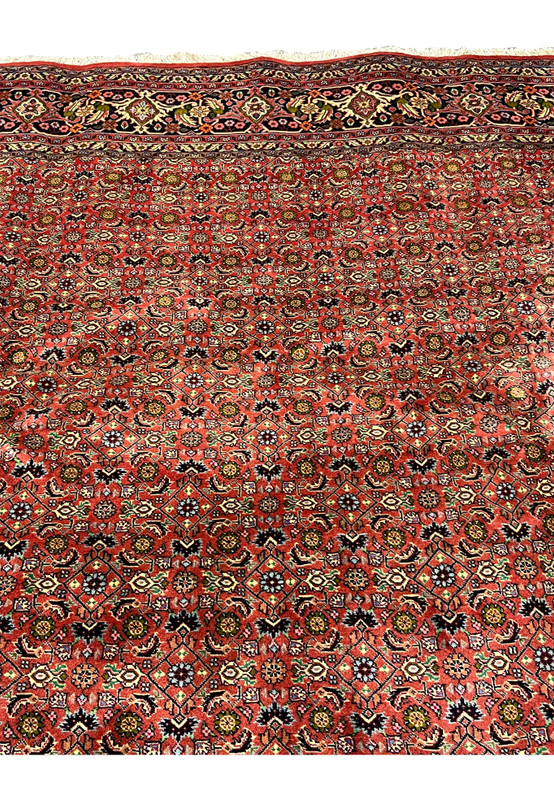 Upper section of Persian Bijar rug showing consistent weave density and harmonious color distribution
