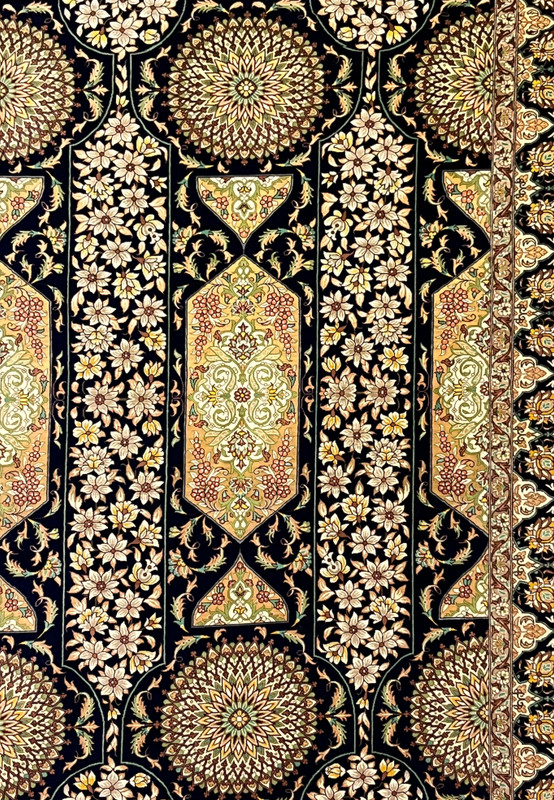 Close up of central floral panels and medallions detailed silk weaving ivory blossoms olive vines and gold accents high density Persian Qum rug