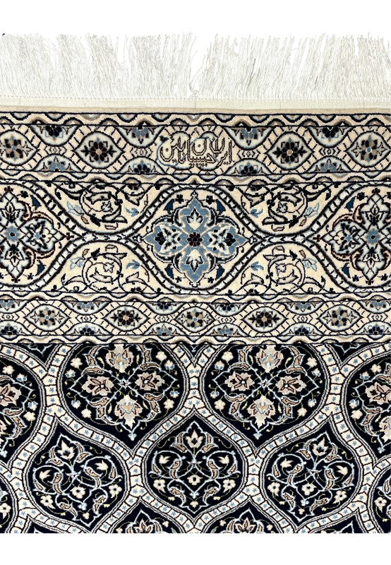 Habibian signature on Persian Nain 6 LA rug ivory border fine knotting silk highlights authentic Iranian weaving.
