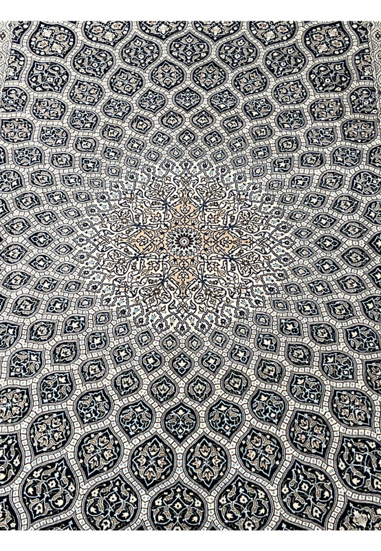 Close view of Nain 6 LA Gombadi dome medallion with silk floral details ivory and navy field fine Habibian craftsmanship.