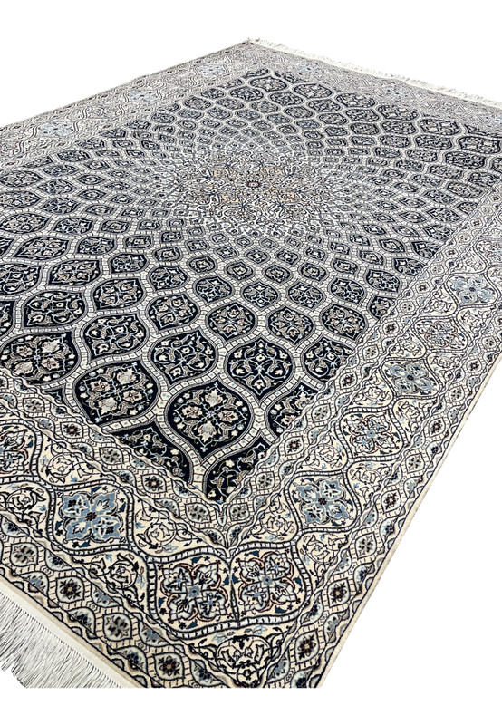 Angled view highlighting depth of navy cartouches and ivory field Persian Nain Habibian 6 LA silk accents.
