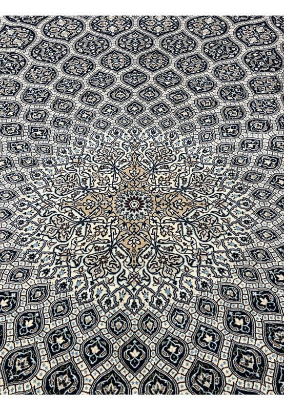 Central dome medallion of Persian Nain Habibian 6 LA rug with silk outlined floral rosettes ivory and camel tones.