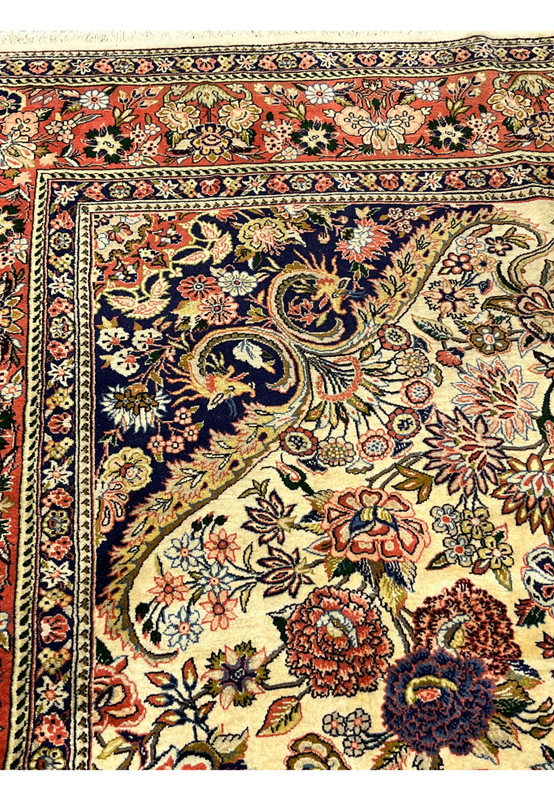 Inner navy border detail on Persian Bijar rug with repeating floral motifs ivory outlines and fine precision