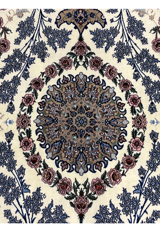 Closeup central medallion Persian Isfahan wool silk rug taupe golden ground blue arabesque scrollwork pink roses