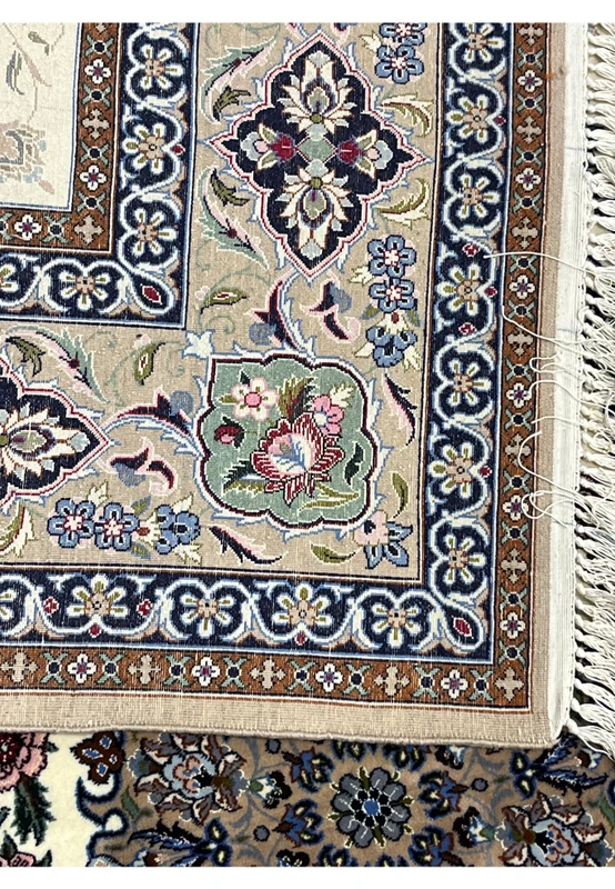 Backside Persian Isfahan wool silk rug showing hand knotted cotton foundation crisp floral pattern Darri signed