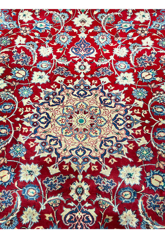 Central medallion closeup 10x13 Persian Isfahan wool rug ivory and navy star medallion on crimson red field handmade