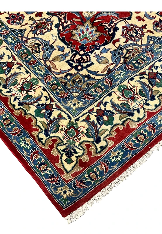 Edge detail 8x12 Persian Isfahan wool rug hand knotted ivory fringe crimson red border blue floral guard stripe