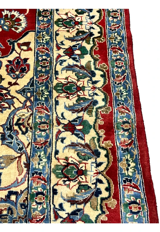 Side border detail 8x12 Persian Isfahan wool rug ivory ground green blue floral palmette scrollwork crimson red field