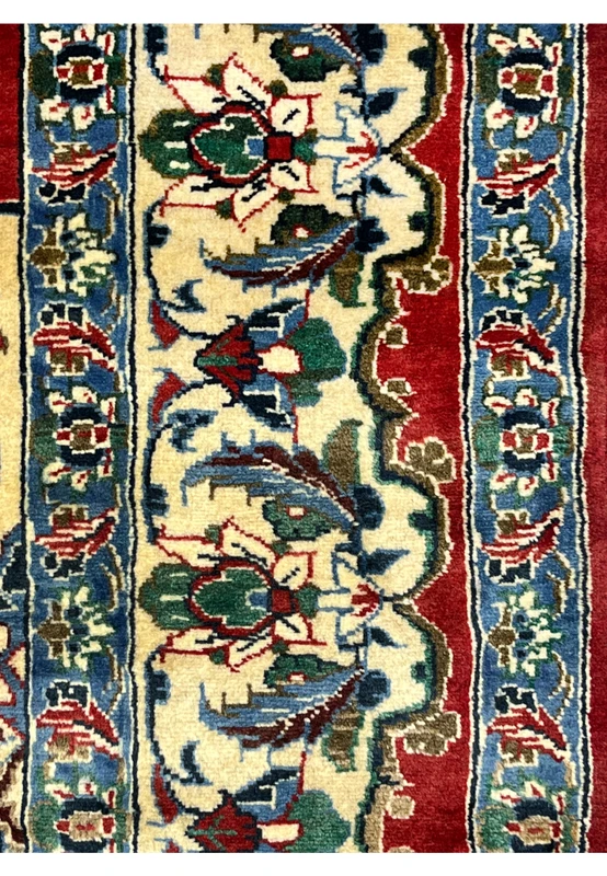 Border closeup 8x12 Persian Isfahan wool rug ivory ground green blue floral vine palmette crimson red surround