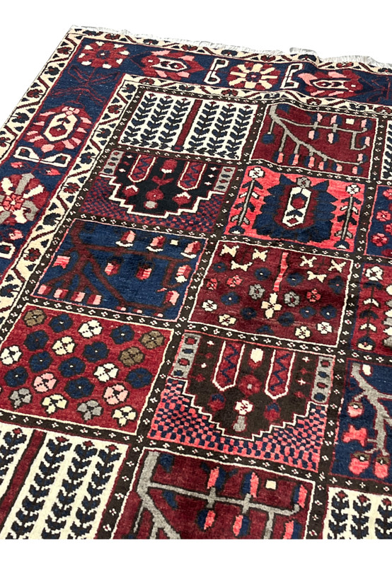 Upper edge and ivory fringe detail of 7x10 hand-knotted Persian Bakhtiari panel rug